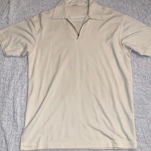 Cream zip up polo shirt.